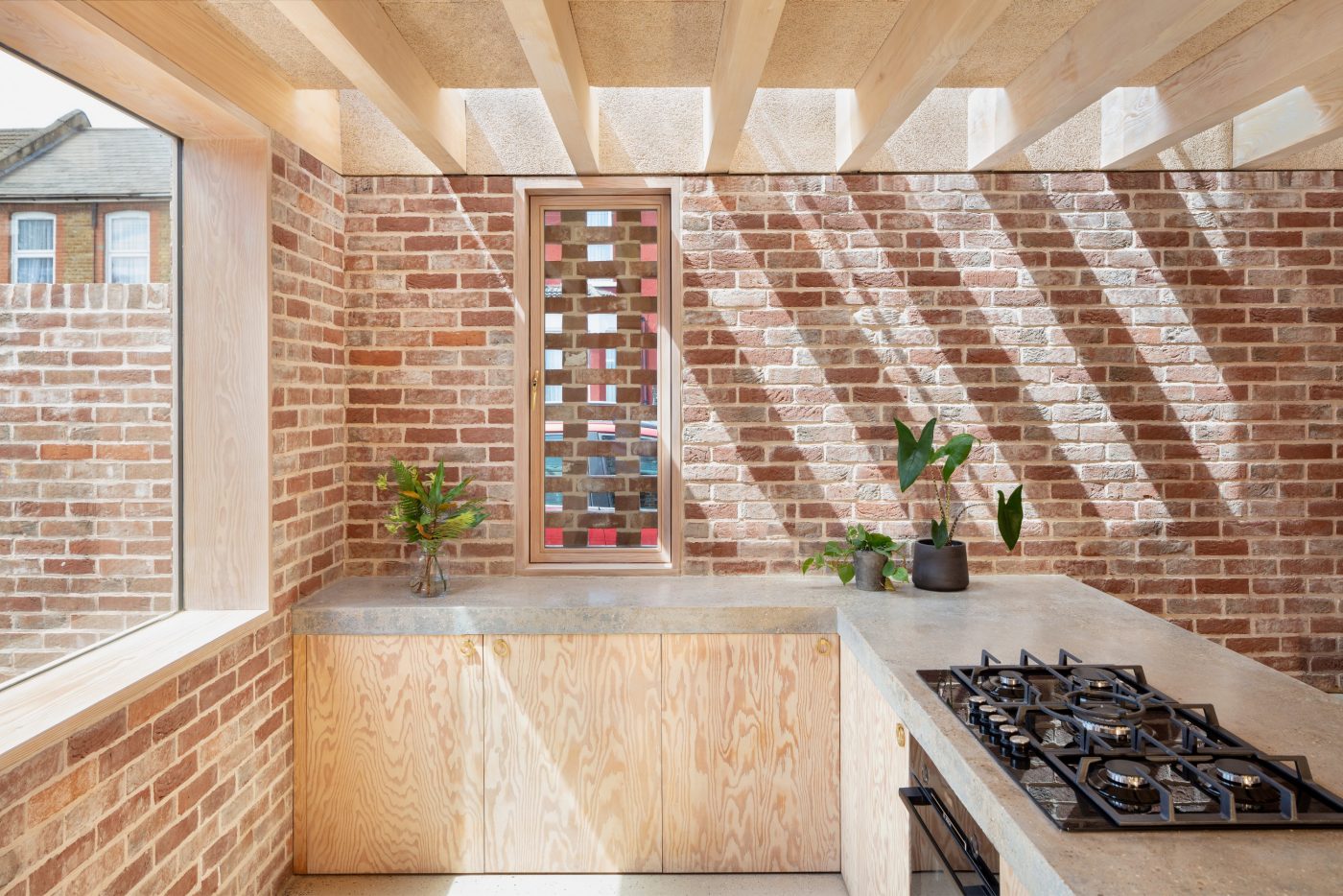 Leyton House. Brick Award 22 Category "Feeling at home". McMahon Architecture. Internal view of kitchen towards main external brick elevation