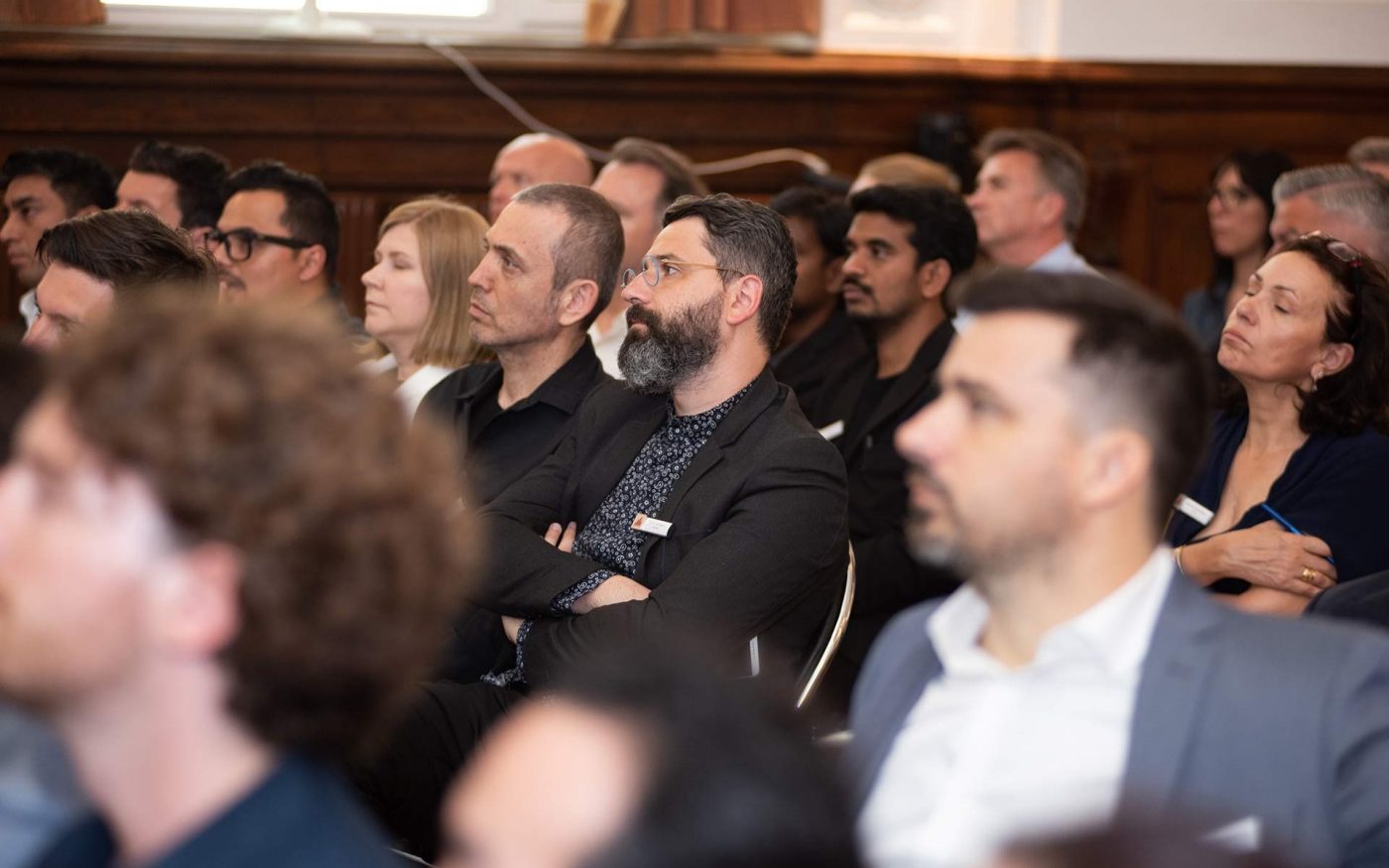 Guests listen Symposium speakers